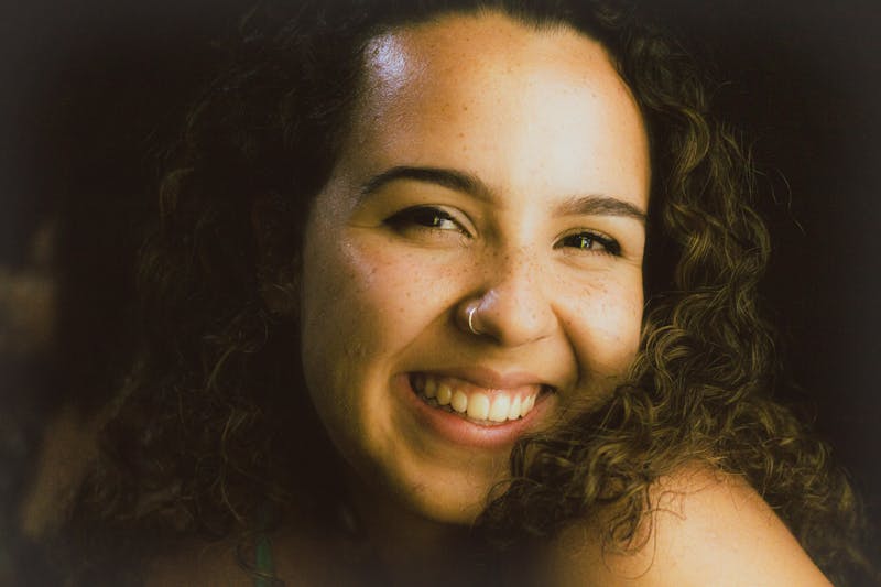 Friendly Pizzana staff member smiling